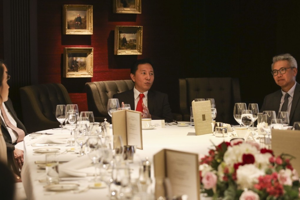 DHL Express Hong Kong and Macau managing director Herbert Vongpusanachai (centre) speaks at the DHL/SCMP Hong Kong Business Awards launch lunch. Photo: K.Y. Cheng
