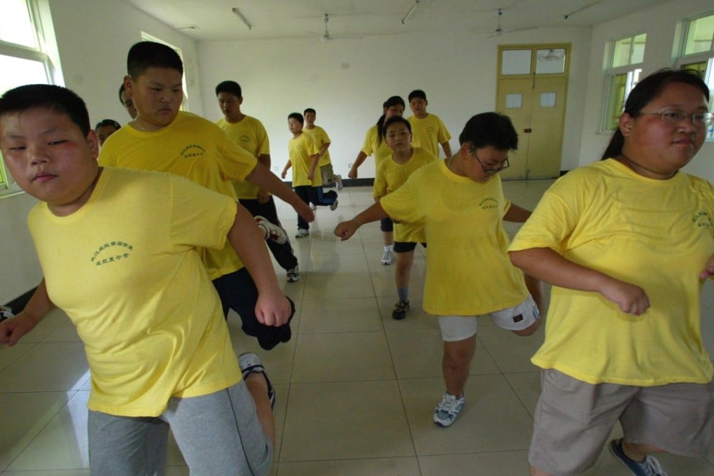 Children go through their paces at a summer camp for overweight youngsters in Wuhan. Photo: AP