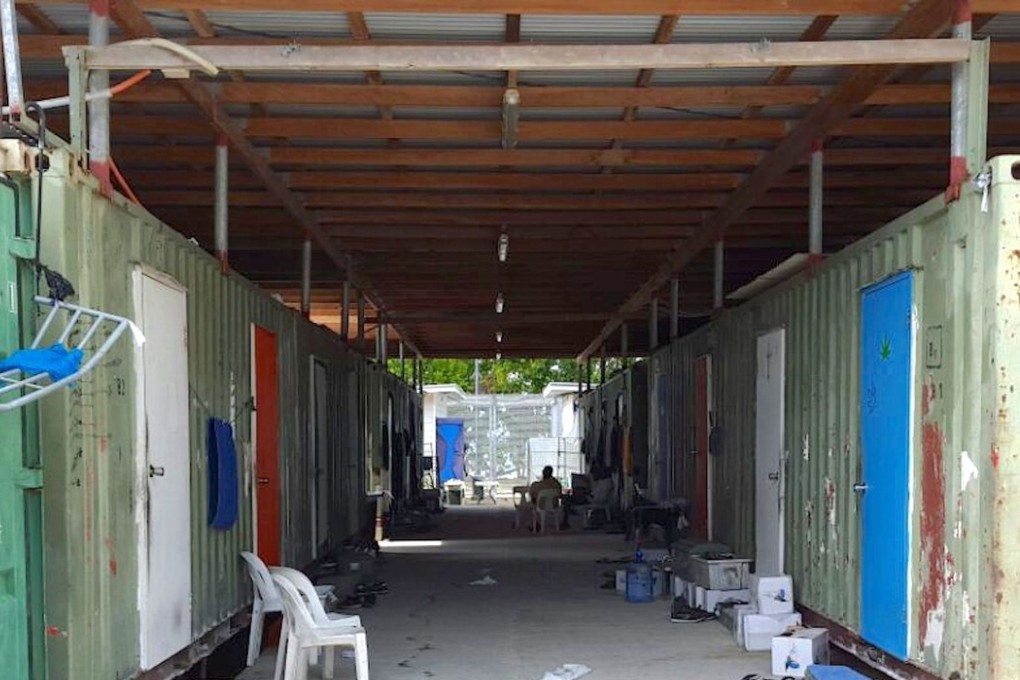 Chairs can be seen outside containers used as shelters inside the Manus Island detention centre in Papua New Guinea. Photo: Reuters