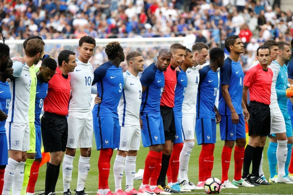 France and England players line up with officials before the match. Photo: Reuters