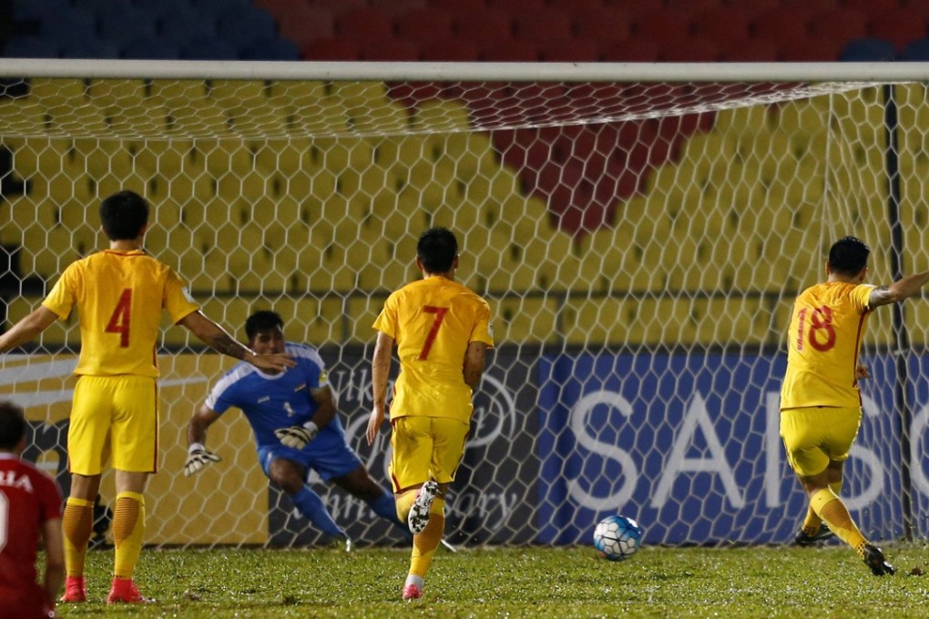 China's Gao Lin scores on a penalty kick against Syria in World Cup qualifiers. The game ended in a 2-2 draw, dimming China’s hopes of qualifying for the tournament in Russia. Photo: Reuters