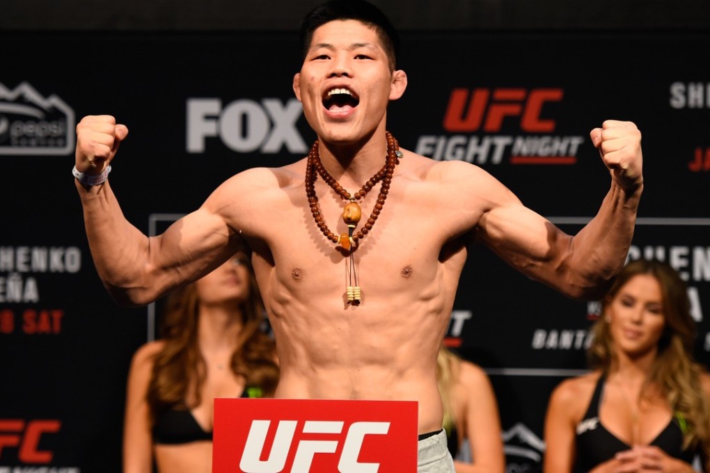 Li Jingliang of China poses on the scale during the UFC Fight Night weigh-in at the Pepsi Centre on January 27, 2017 in Denver, Colorado. Photo: Getty Images/ Zuffa LLC