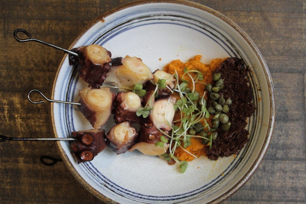 Grilled octopus skewers with black olive tapenade, carrot purée and capers at Tokyolima. Photo: James Wendlinger