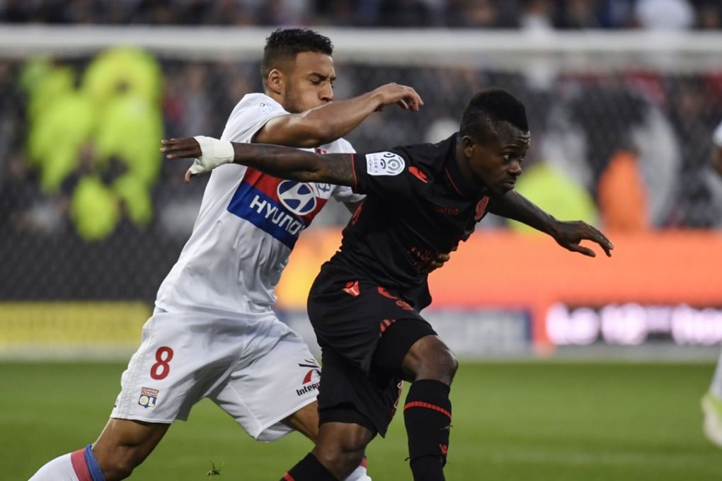 Nice's Ivorian midfielder Jean Michael Seri (R) vies with Lyon's French midfielder Coretin Tolisso (L) during the French L1 football match between Lyon (OL) and Nice (OGCN). Tolisso is going to play for Bayern Munich in a record transfer for the Bundesliga. Photo: