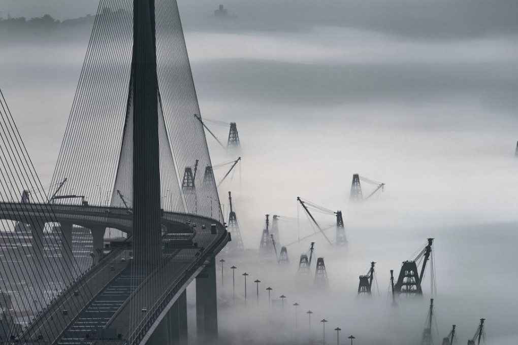 Stonecutters Bridge surrounded by fog. Photo: Edward Tin