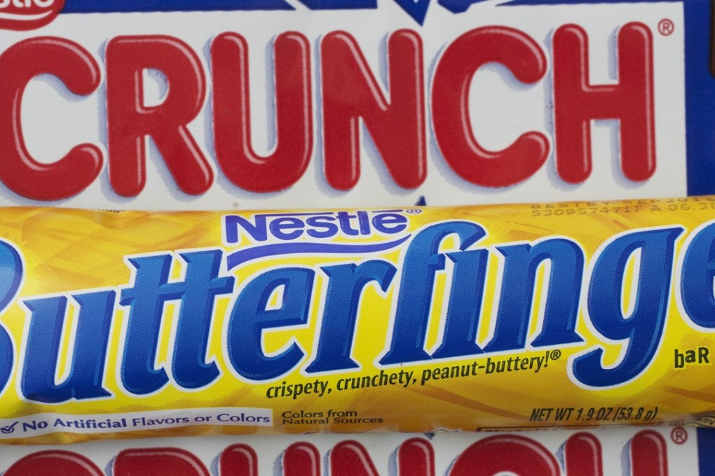 A Nestle Butterfinger and Crunch candy bars are arranged for a photo in New York. On Thursday, June 15, 2017, Nestle said it’s considering a sale of its US candy business. The unit includes brands like Butterfinger, Baby Ruth, 100 Grand, Skinny Cow and Raisinets. Photo: AP