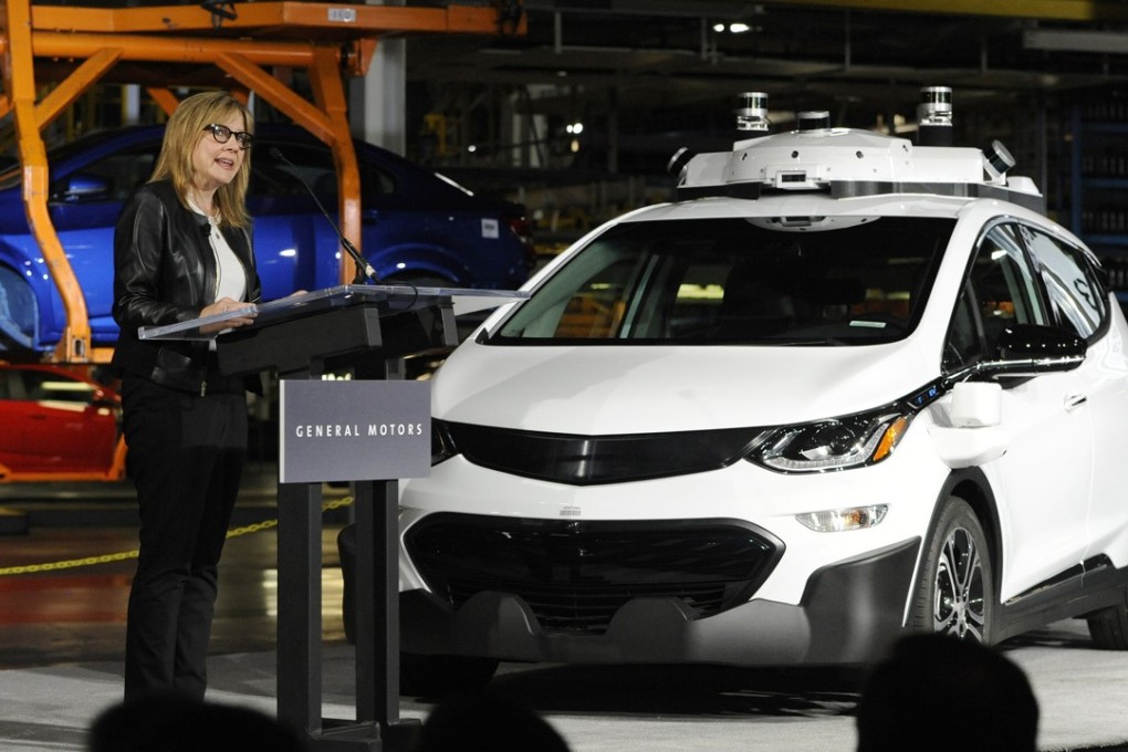 General Motors chair and CEO Mary Barra stands next to a self-driving Chevrolet as she gives updates about the company’s autonomous vehicle development programme, in Michigan on June 13. Photo: AP