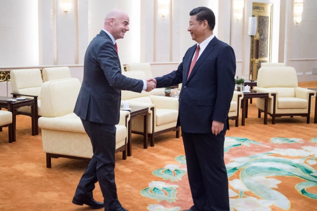 Xi Jinping welcomes Gianni Infantino to the Great Hall of the People. Photo: Reuters