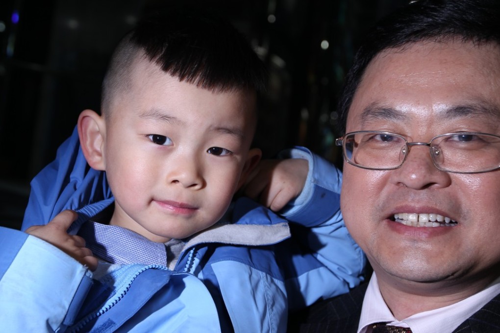 He Liesheng and his son He Yide in Beijing in February 2012. Photo: Simon Song