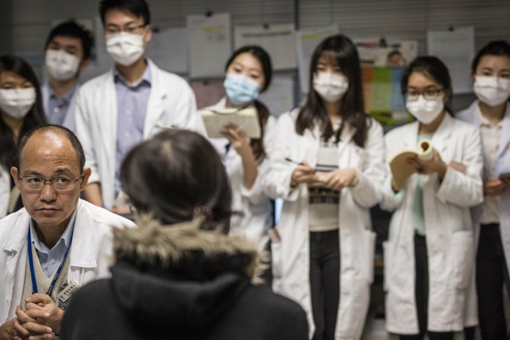 A doctor on his rounds, with students doctors in tow. Photo: Ducky Tse Chi-tak