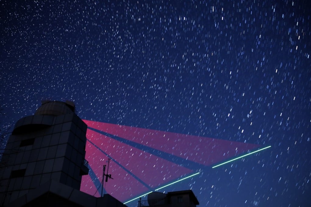 A composite photo taken last November showing a link between a ground station in Xinglong, in north China’s Hebei province, and the “Micius” satellite. Photo: Xinhua