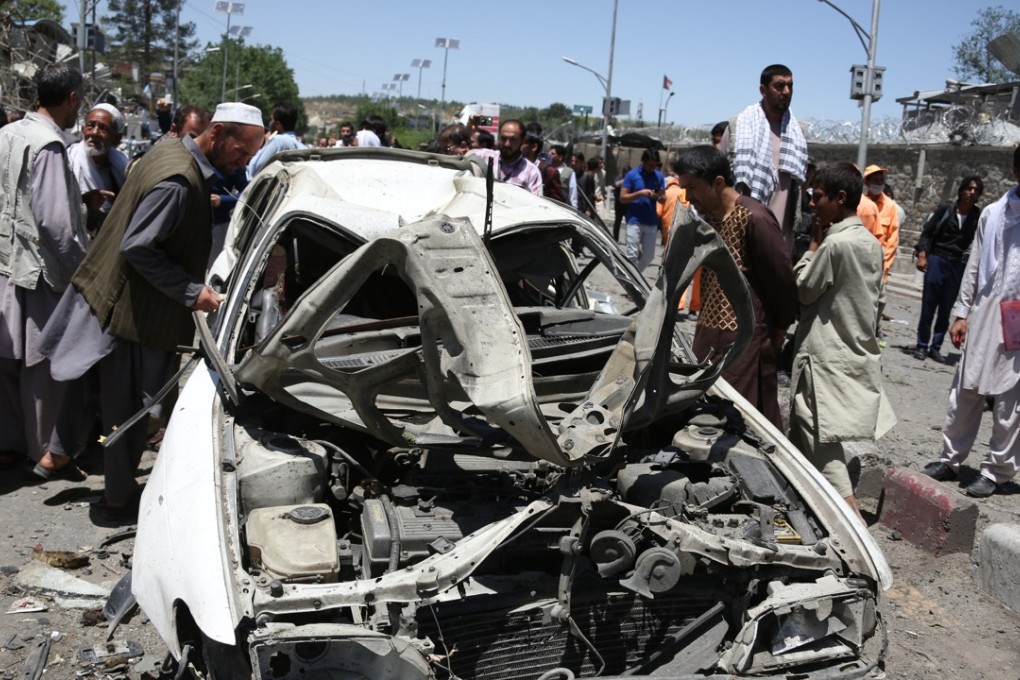 A crowd gathers at the site of a car bomb explosion in Kabul on May 31. Photo: Xinhua