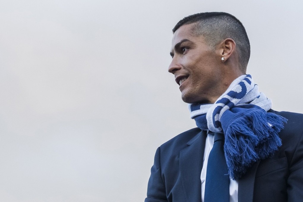 Cristiano Ronaldo aboard the open-top bus during the Real Madrid’s Champions League trophy parade. Photo: EPA