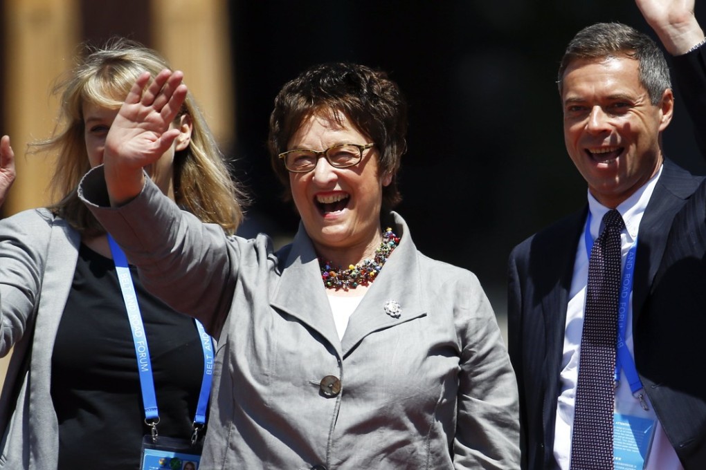 German Economy Minister Brigitte Zypries waves as she arrives for a group photo on the second and last day of the Belt and Road Forum in Beijing, on May 15. Photo: EPA
