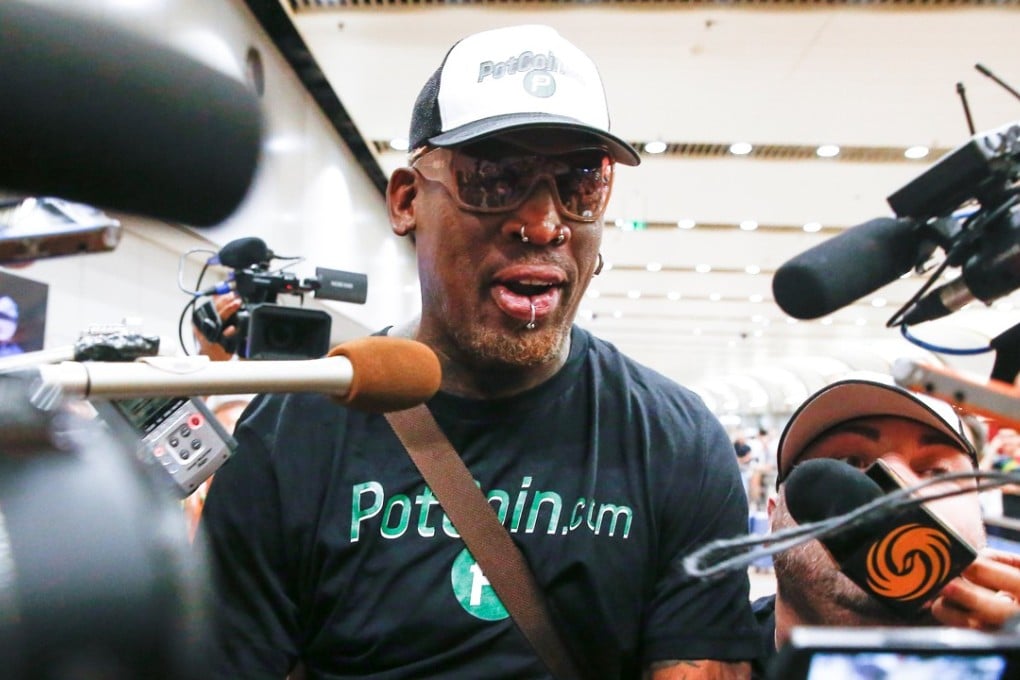 Former NBA basketball player Dennis Rodman is surrounded by the media after arriving from North Korea's Pyongyang at Beijing airport. Photo: Reuters