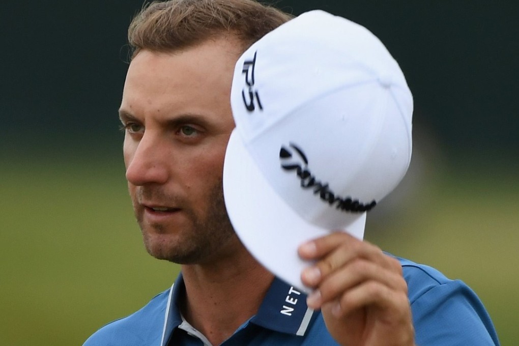 Dustin Johnson of the United States reacts after finishing on the 18th green. Photo: AFP