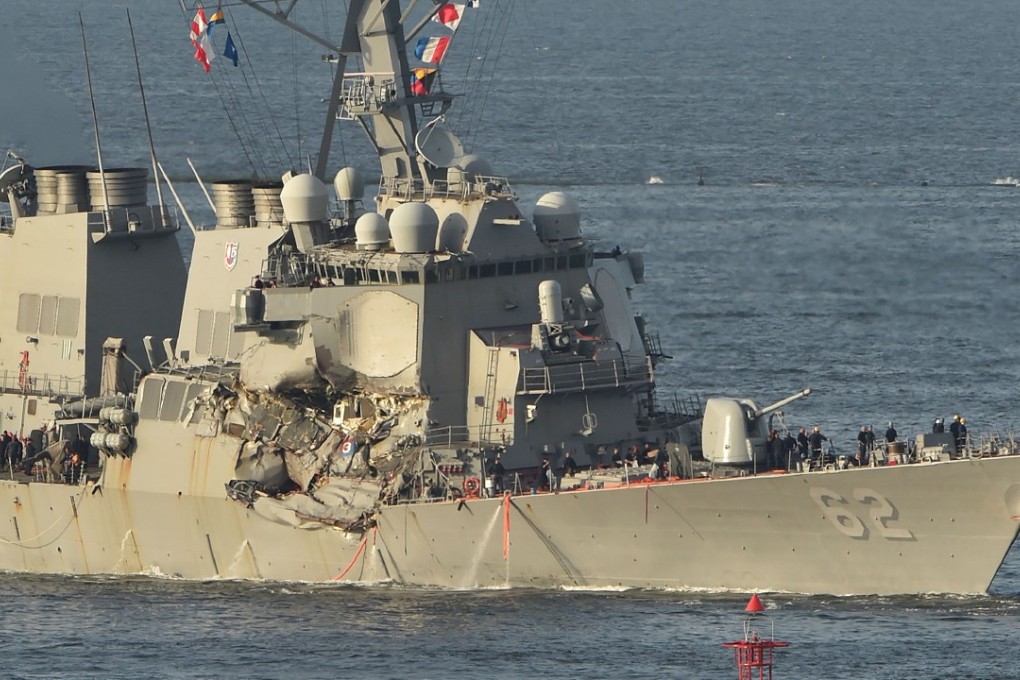 The damaged USS Fitzgerald arrives at US Naval Yokosuka Base. Photo: AFP