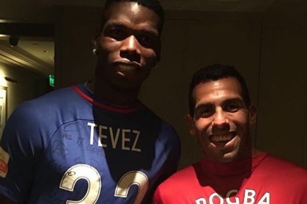 Paul Pogba and Carlos Tevez pose in each other's shirts. Photo: @paulpogba