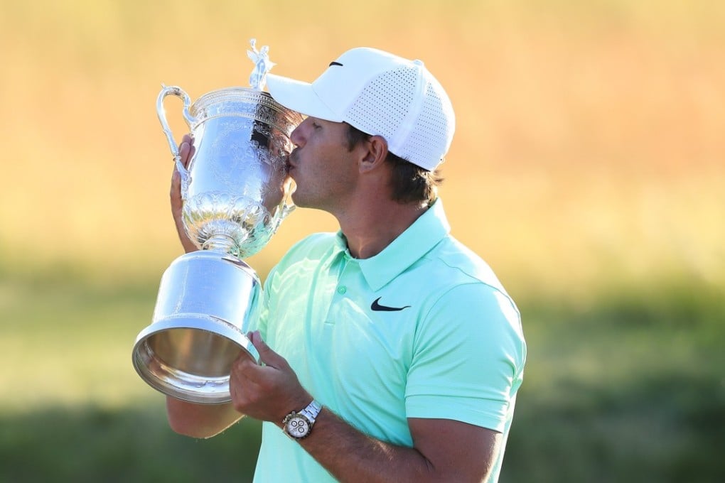 Brooks Koepka of the US celebrates with the trophy after winning the 117th US Open Championship at Erin Hills in Hartford, Wisconsin. Photo: EPA