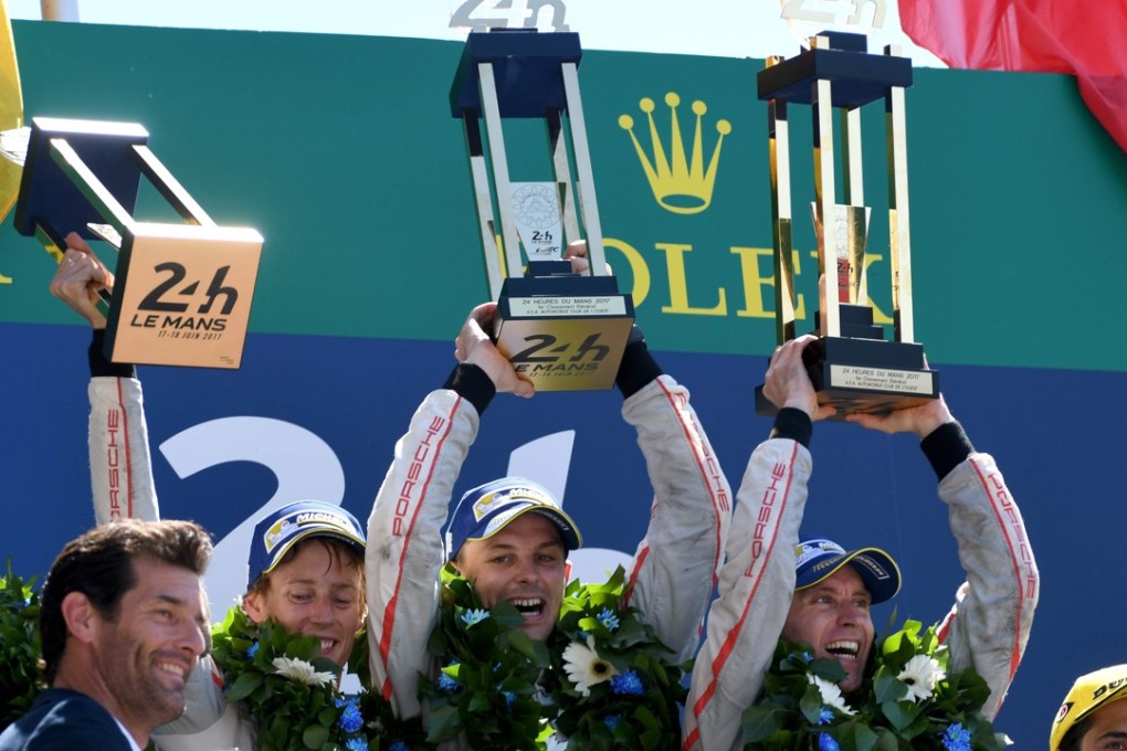 New Zealand's driver Brendon Hartley, New Zealand's driver Earl Bamber and Germany's driver Timo Bernhard celebrate on the podium after winning the 85th Le Mans 24-hours endurance race. Photo: AFP
