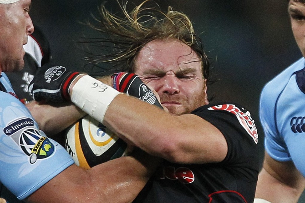 Andy Goode played for numerous clubs, including the Natal Sharks, as well as England. Picture carrying the ball into contact for . Photo: Reuters