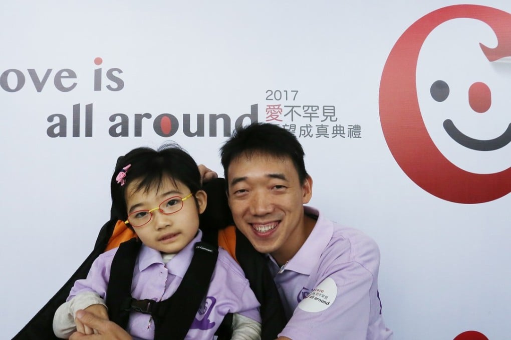 Byron Lai Chi-yung with his daughter Lai Wai-ting, who suffers from a rare neurological developmental disorder. Photo: Jonathan Wong