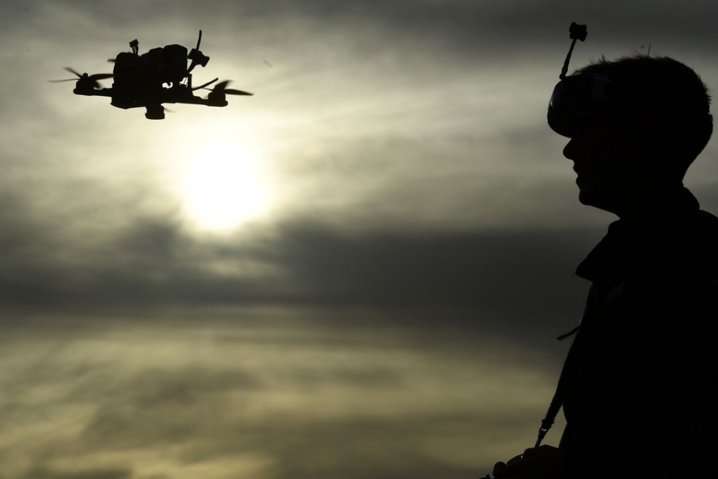 Drone racing champion Luke Bannister poses for a photograph as he flies his first-person view (FPV) drone in Wiltshire, western England. Photo: AFP/Ben STANSALL