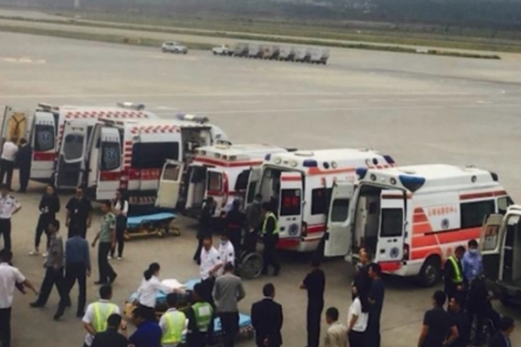 Ambulance wait on the tarmac of Kunming airport to ferry injured passengers to hospital. Photo: Handout