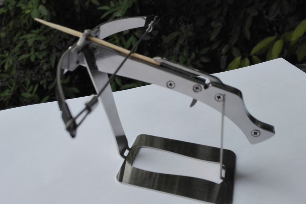 A toothpick crossbow mounted on a stand. Photo: Handout