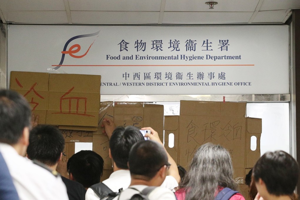 Activists protest over a decision by the Food and Environment Hygiene Department to arrest a 75-year-old woman who sold her cardboard without a licence. Photo: Handout