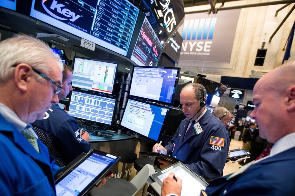 Traders work on the floor of the New York Stock Exchange as a rebound in technology stocks sparked a rally in the market. Photo: Bloomberg