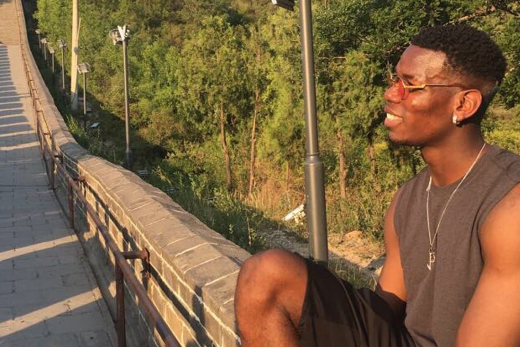 Paul Pogba sits on the Great Wall of China. Photo: @paulpogba