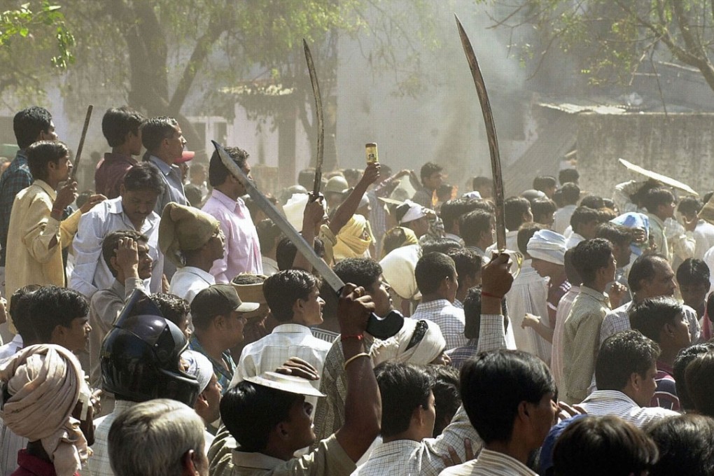 A Hindu mob during the 2002 communal riots, in Ahmedabad, Gujarat, an incident referenced in Arundhati Roy’s novel The Ministry of Ultimate Happiness. Picture: AFP