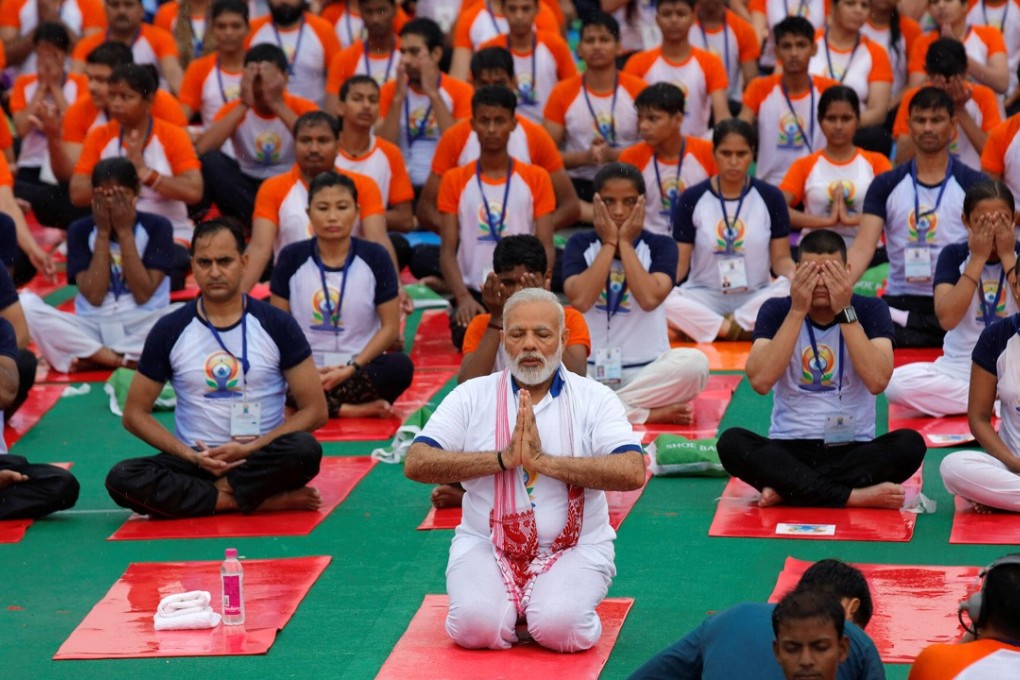 Indian Prime Minister Narendra Modi performs yoga on International Yoga Day in Lucknow. Photo: Reuters