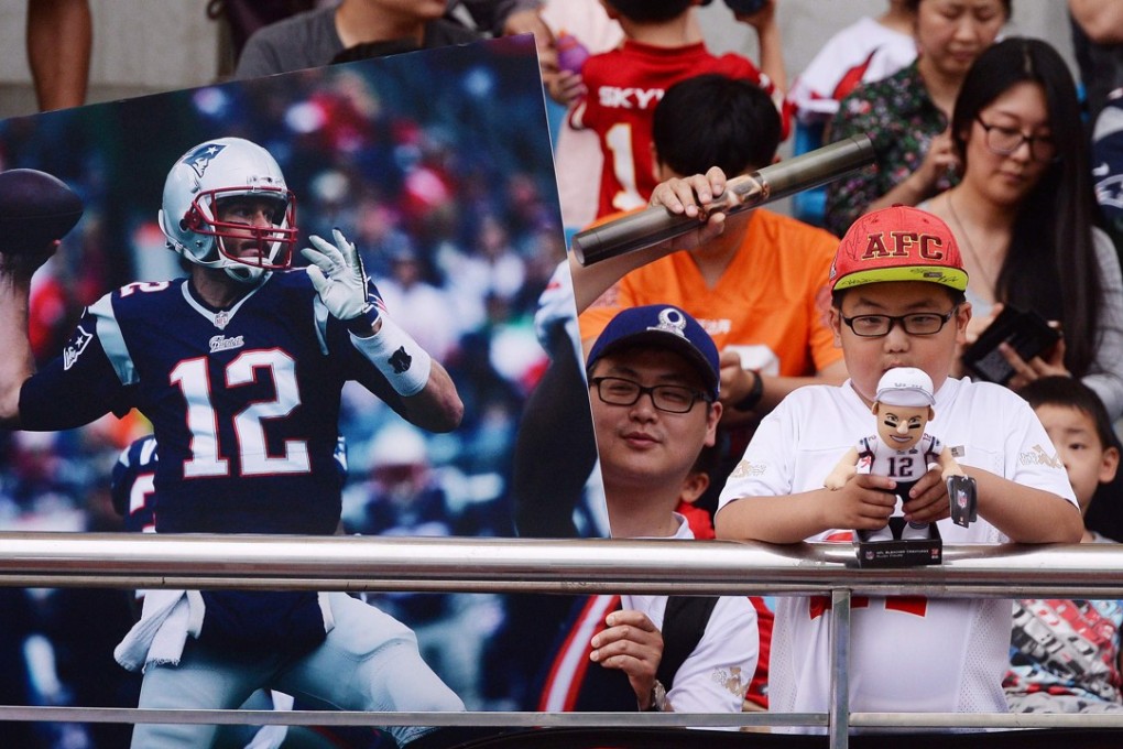 Fans wait for New England Patriots quarterback Tom Brady in Shanghai. Photo: AFP
