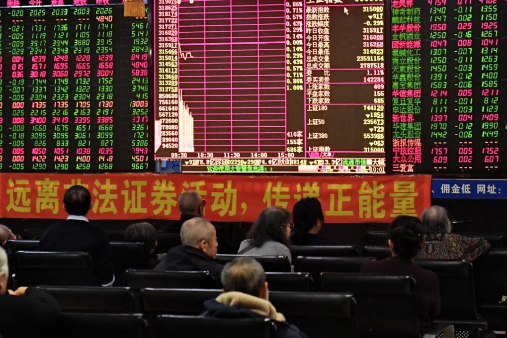 Investors look through stock information at a trading hall in Changchun, capital of northeast China's Jilin Province. Chinese A-shares were accepted on Tuesday by index provider MSCI to its emerging markets index. Photo: Xinhua