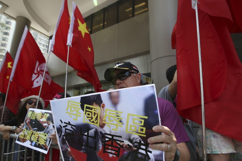 Opponents to localist lawmaker Cheng Chung-tai (not pictured) gather at the Eastern Law Courts Building. Cheng is charged with desecrating the national and Hong Kong flags at the Legislative Council in October 2016. Photo: Edward Wong