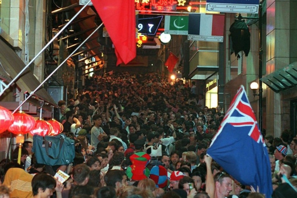 Party-goers pack the streets of Lan Kwai Fong on the night of the handover to mark Hong Kong's return to China after 156 years of British colonial rule. Photo: AFP