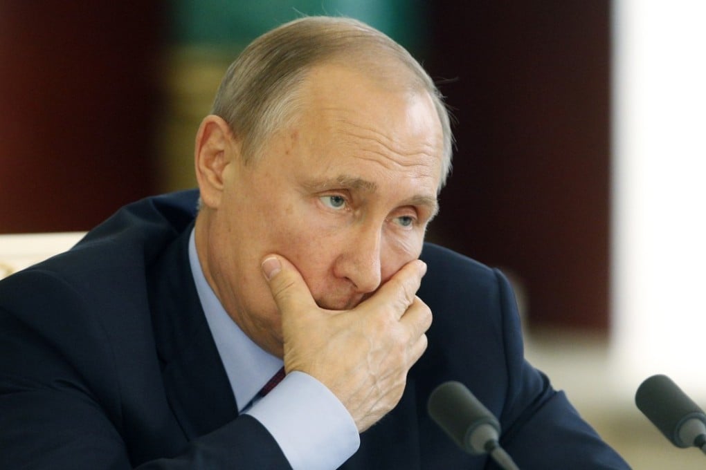 Russian President Vladimir Putin attends a signing ceremony in Moscow. His government cancelled talks with the US after Washington slapped new sanctions on Russia over Ukraine. Photo: Pool via AP