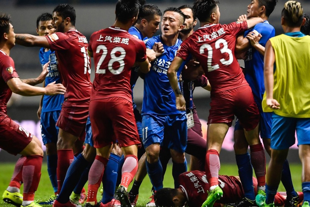 Shanghai SIPG’s Oscar lies on the floor after being pushed to the ground against Guangzhou R&F. Photo: AFP
