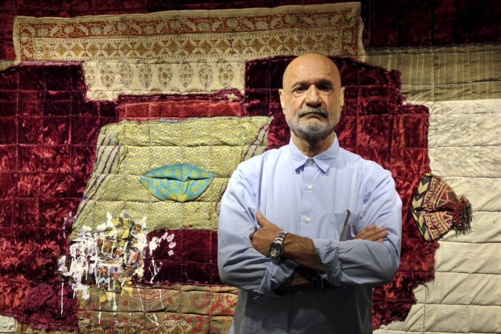 Iranian artist Fereydoun Ave poses with ‘Lahaf 17’, made with a traditional Persian blanket and a patchwork of fabrics including a velvet seat covering from his late grandmother's house. Photo: Enid Tsui