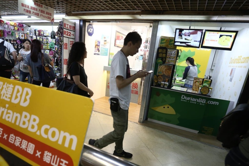 Telecom Digital paid HK$30 million for this Kwun Tong shop lot that’s been subdivided into two stores, the first selling durian desserts, and the other a money changer. Photo: Jonathan Wong