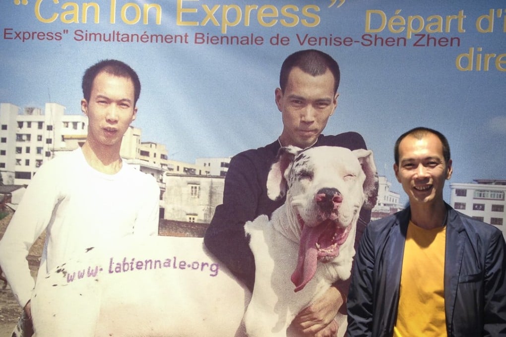 Zheng Guogu poses in front of a poster used to promote the 2003 Venice Biennale exhibition Canton Express featuring works by him and 13 fellow southern Chinese artists, and which has been restaged in Hong Kong. Photo: Enid Tsui