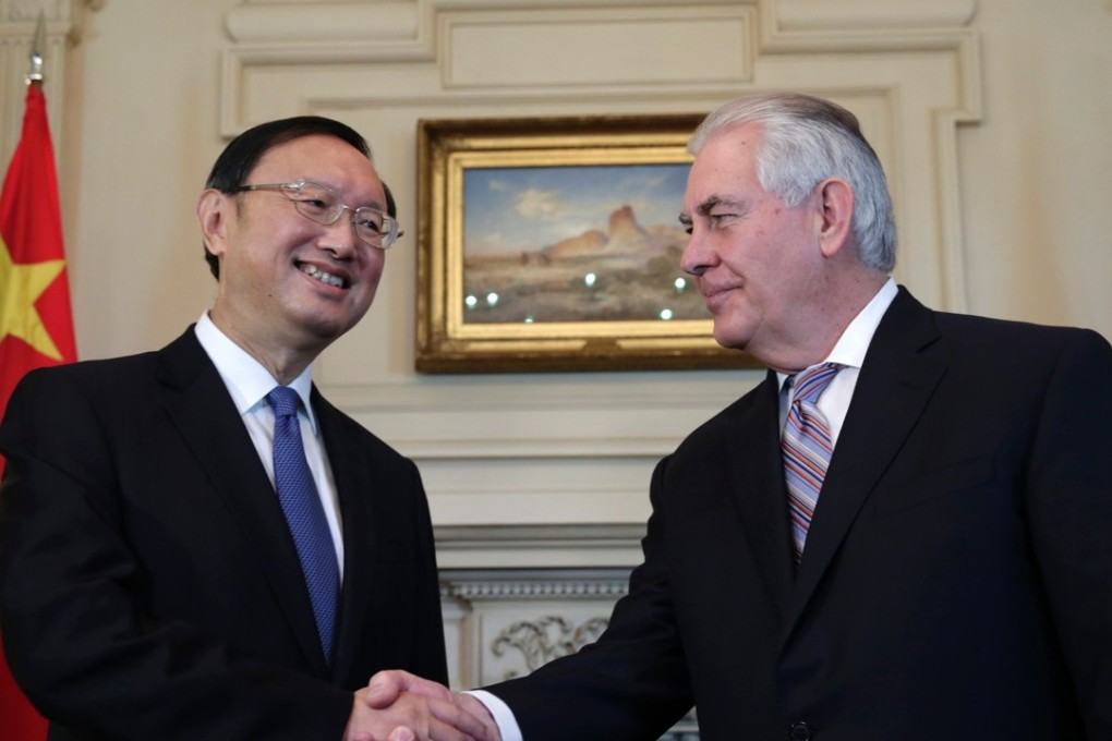 Chinese State Councilor Yang Jiechi shakes hands with US Secretary of State Rex Tillerson before their meeting in Washington in February. Photo: AFP