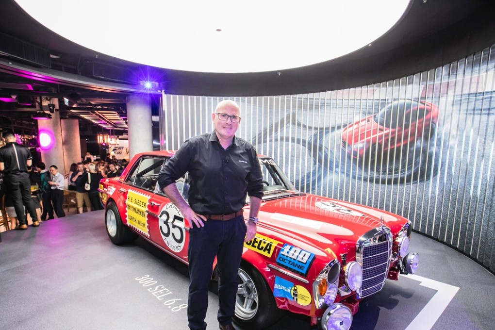 Mercedes-AMG product manager Joerg Letzel with the 1971 AMG 300 SEL 6.8 'Red Giant' at Mercedes Me, Central. Photo: Handout