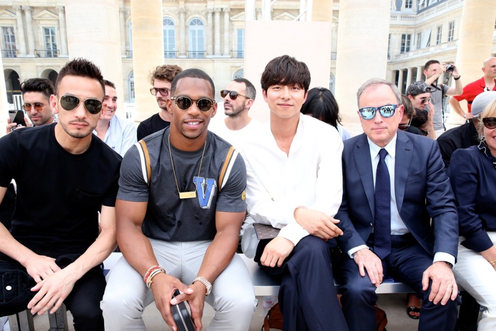 Stylist Kim Jones and Gong Yoo pose after the Louis Vuitton Menswear  Spring/Summer 2018 show as part of Paris Fashion Week on …
