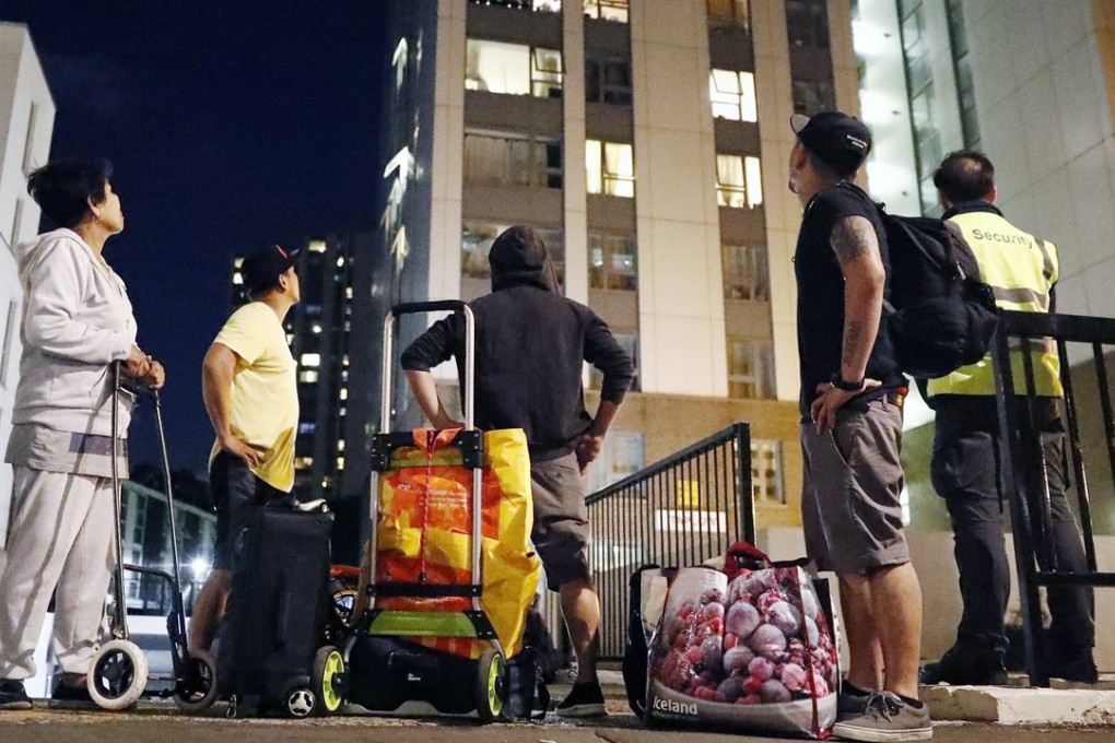 Residents evacuate from Chalcots Estate tower blocks in Camden, London. Photo: EPA