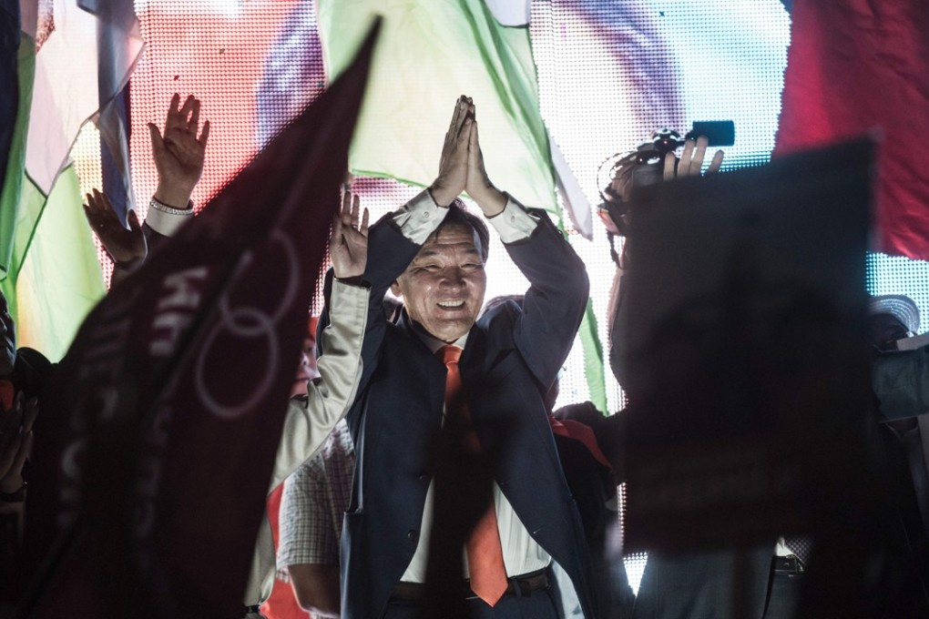 Mongolian presidential election candidate Ganbaatar Sainkhuu waves to supporters at a rally. Photo: AFP