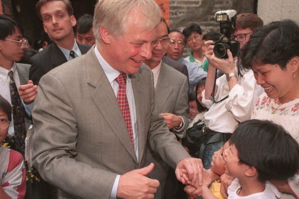 Governor Chris Patten chatting with a child while visiting Nam Pin Wai village in Yuen Long. Photo: John Lehmann