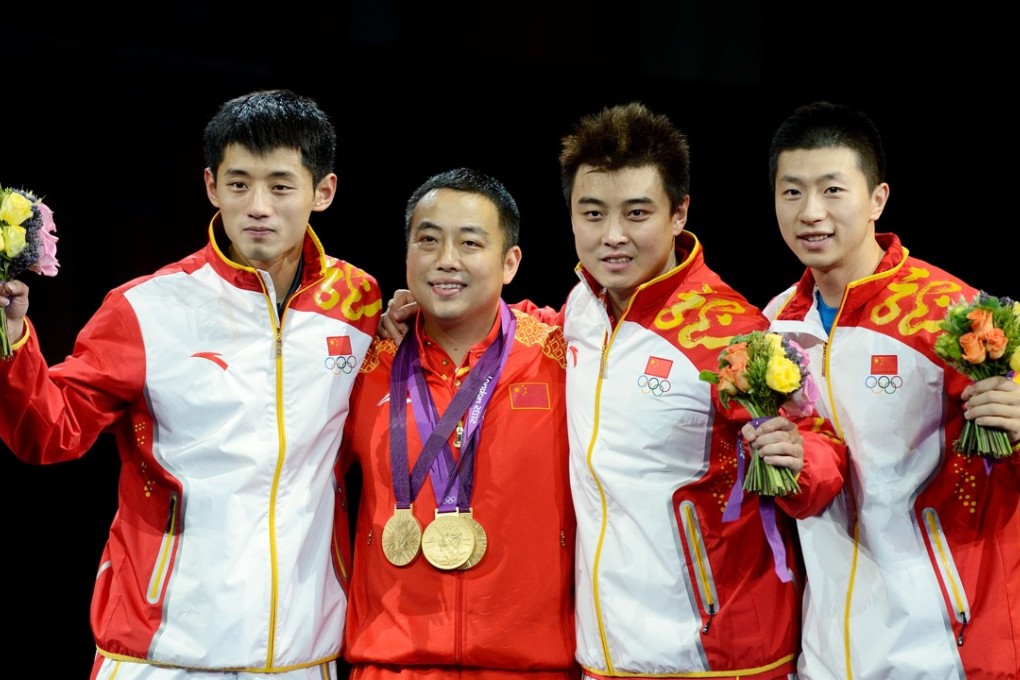 Liu Guoliang (second from left) with Chinese team members Zhang Jike, Wang Hao and Ma Long after winning gold in the men’s team competition at the London Olympics. Photo: Xinhua